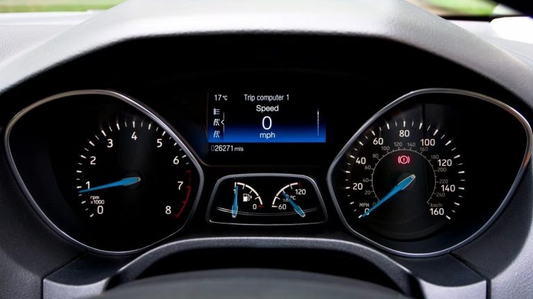 Close-up view of a Ford Focus dashboard showing the speedometer and various gauges.